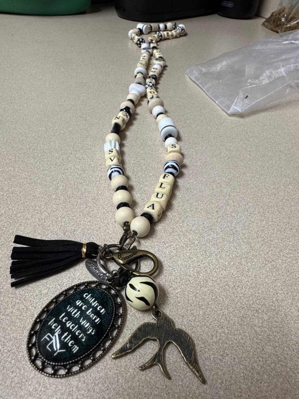 Plunder Black and Cream Beaded Tassel Necklace with Bird Charm